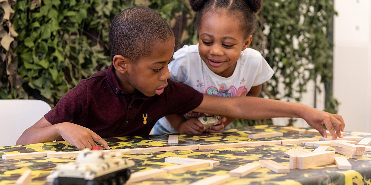 Children playing with building blocks at a family workshop