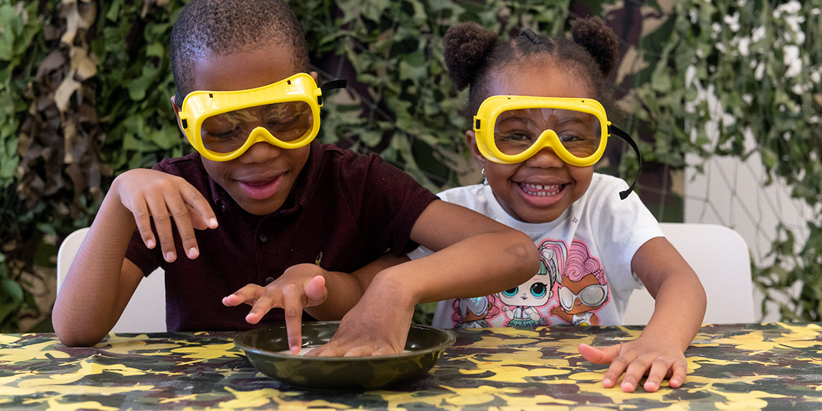 Children playing with slimy stuff at a family workshop