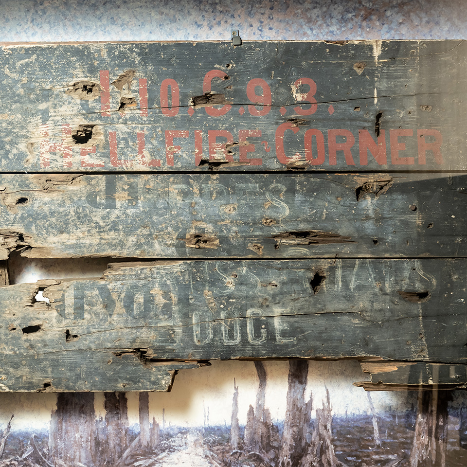 Wooden painted signboard from ‘Hellfire Corner’ at Ypres, 1918