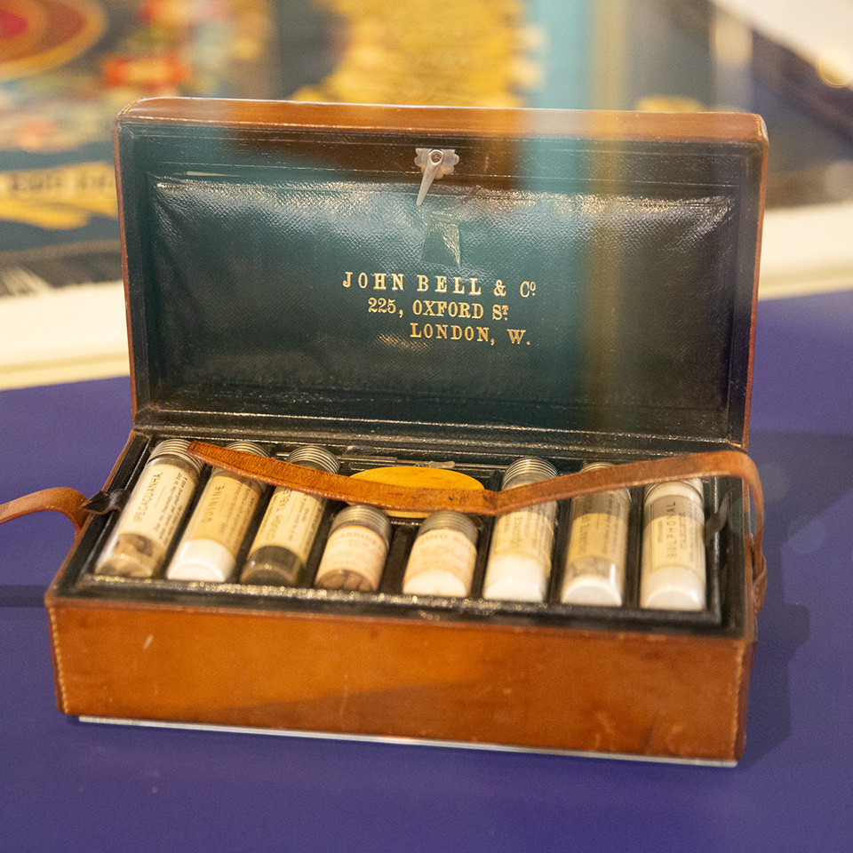 Brown leather wallet containing labelled medicine bottles, c1890s