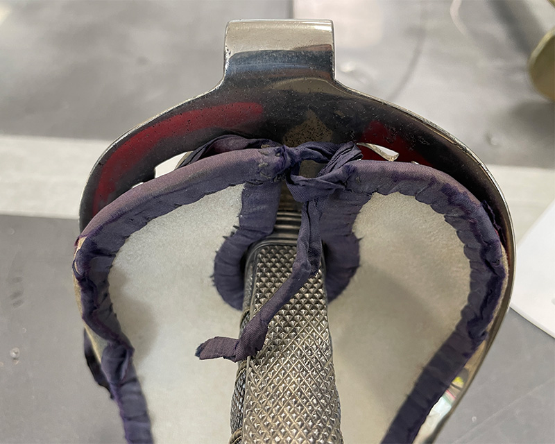A view of the sword guard's liner before treatment
