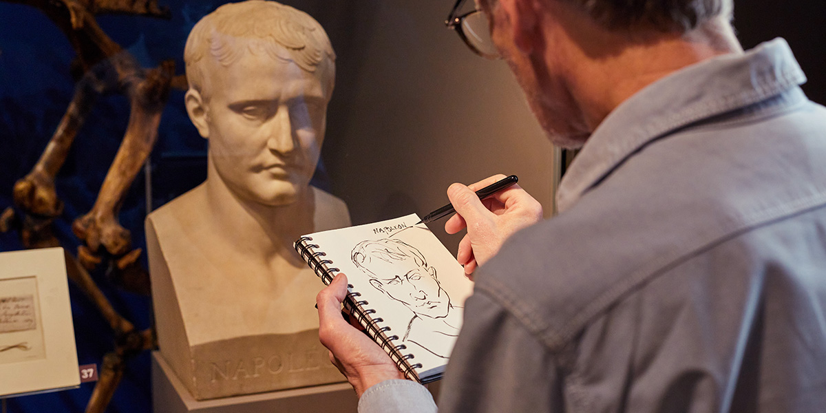 A visitor sketching a bust of Napoleon