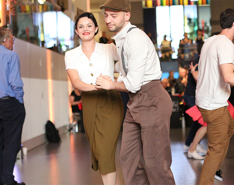People dressed in 1940s style dancing at the National Army Museum