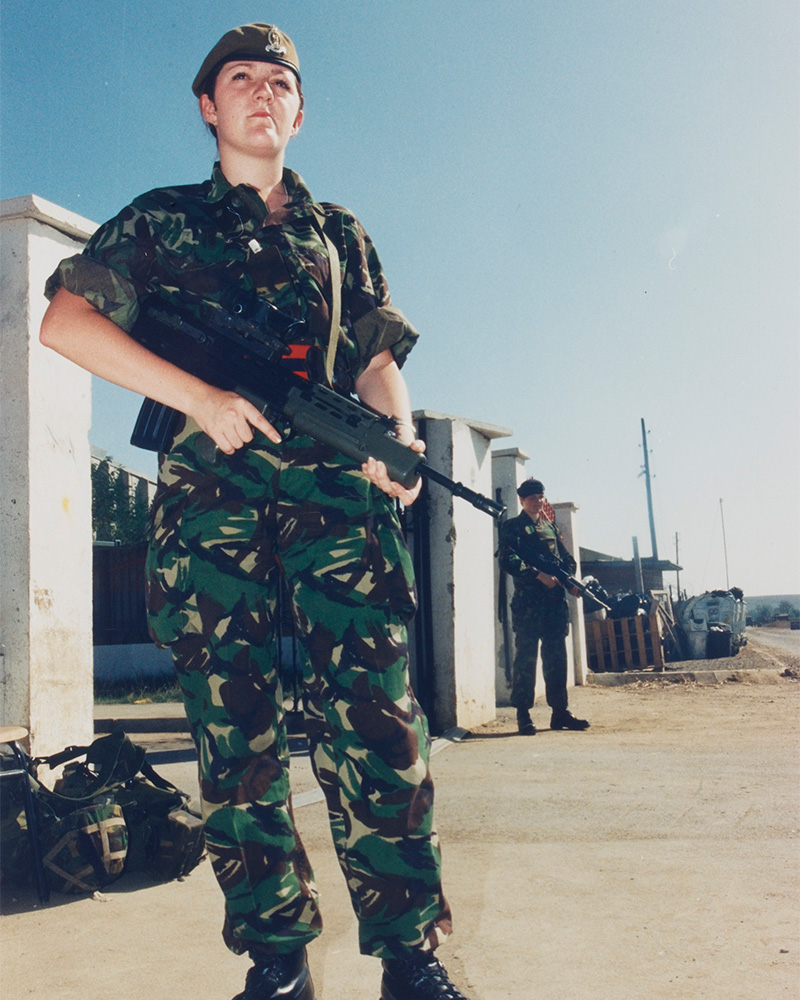 Private Leanne Jordan guarding the British Force Headquarters main gate, Kosovo, 1999