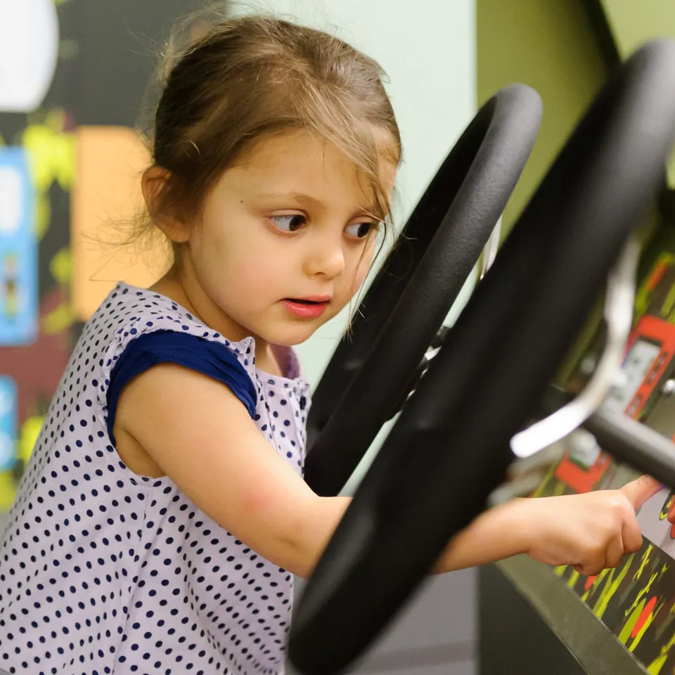 A child on the Play Base command liaison vehicle