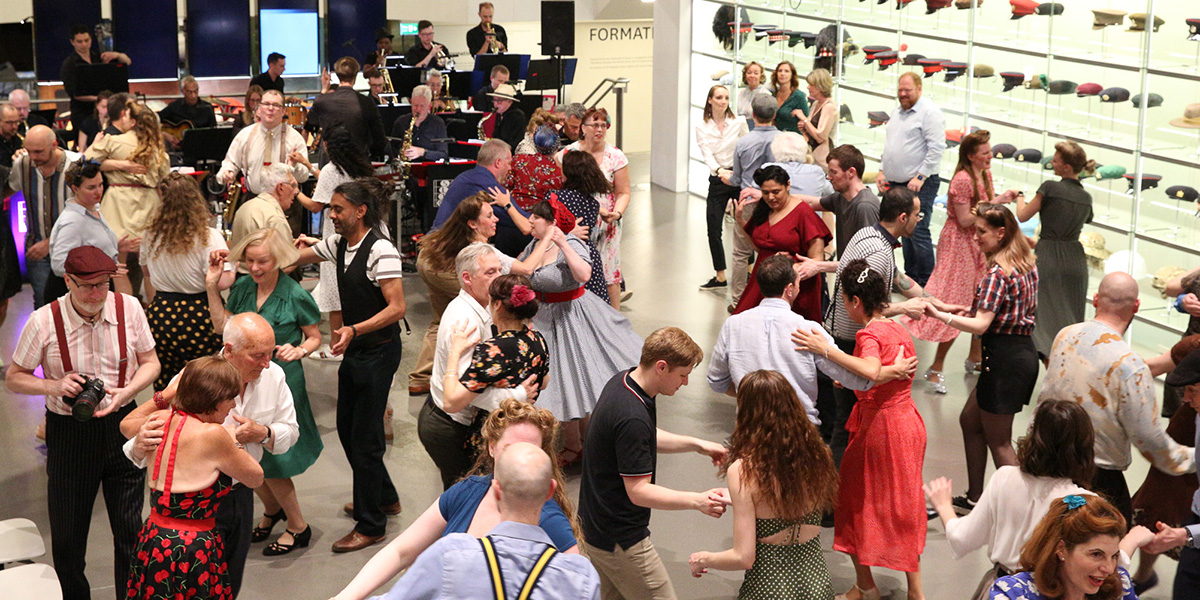 People dressed in 1940s style dancing at the National Army Museum