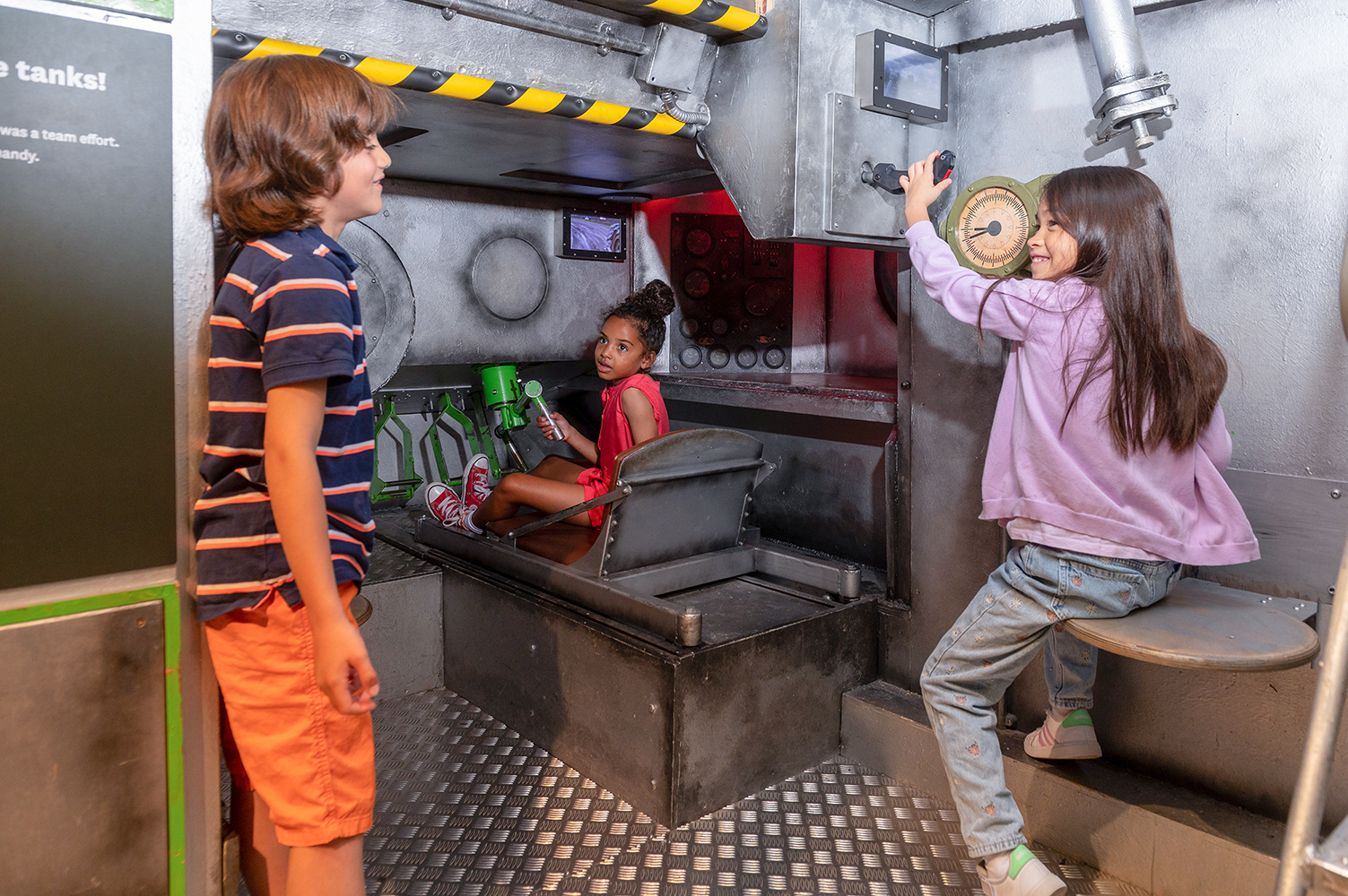 Children enjoying the tank in the Conflict in Europe gallery