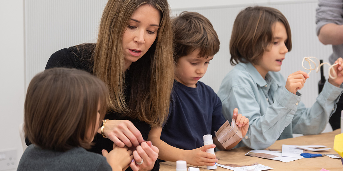 A family taking part in a craft workshop