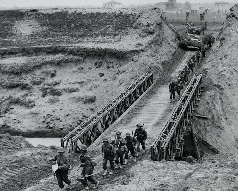 Infantry and tanks crossing the bridgehead over the River Santerno, April 1945