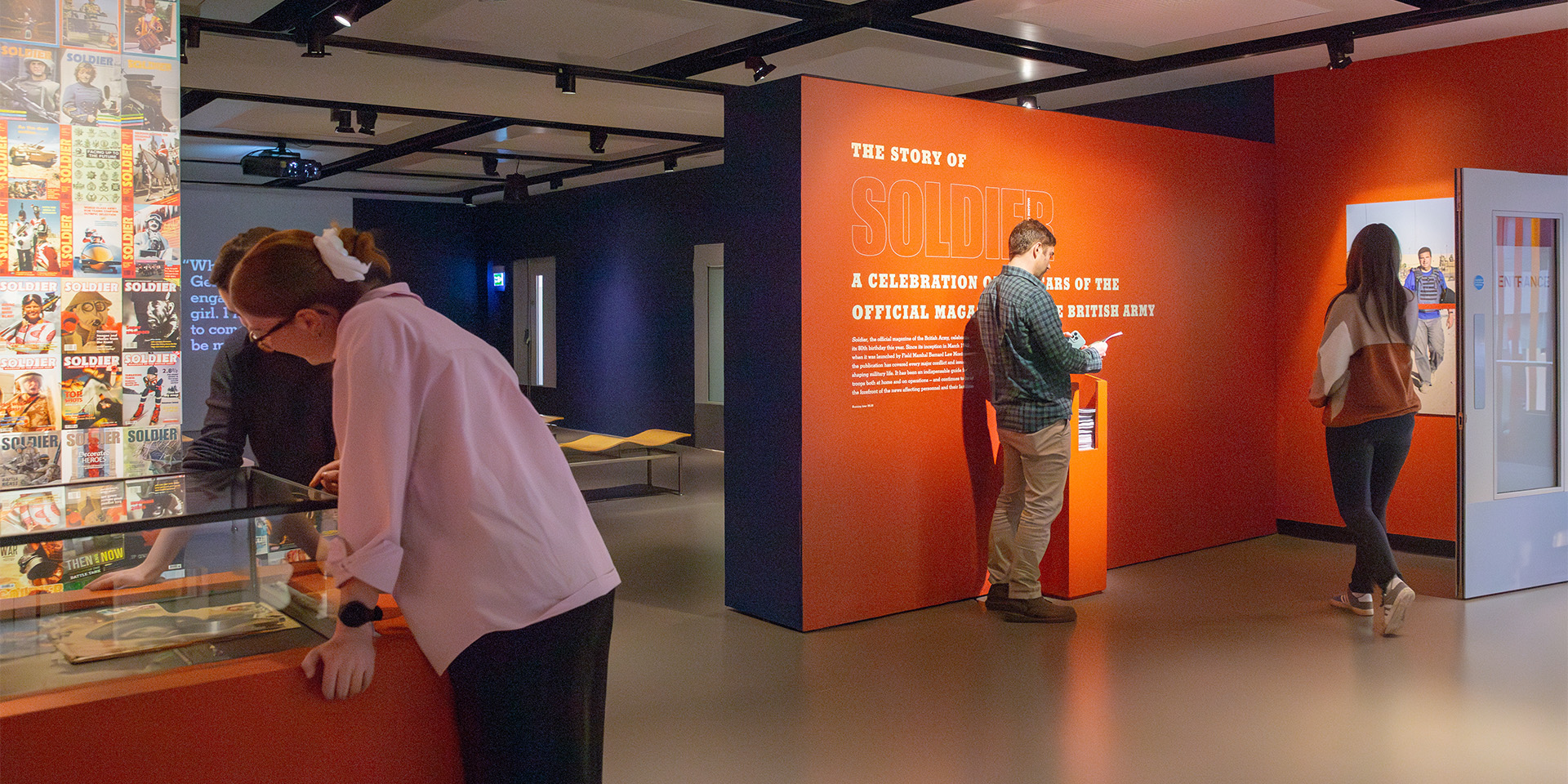 Visitors in 'The Story of Soldier Magazine' display