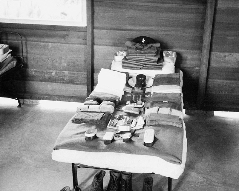 Kit laid out on a barrack bed ready for inspection, 1955