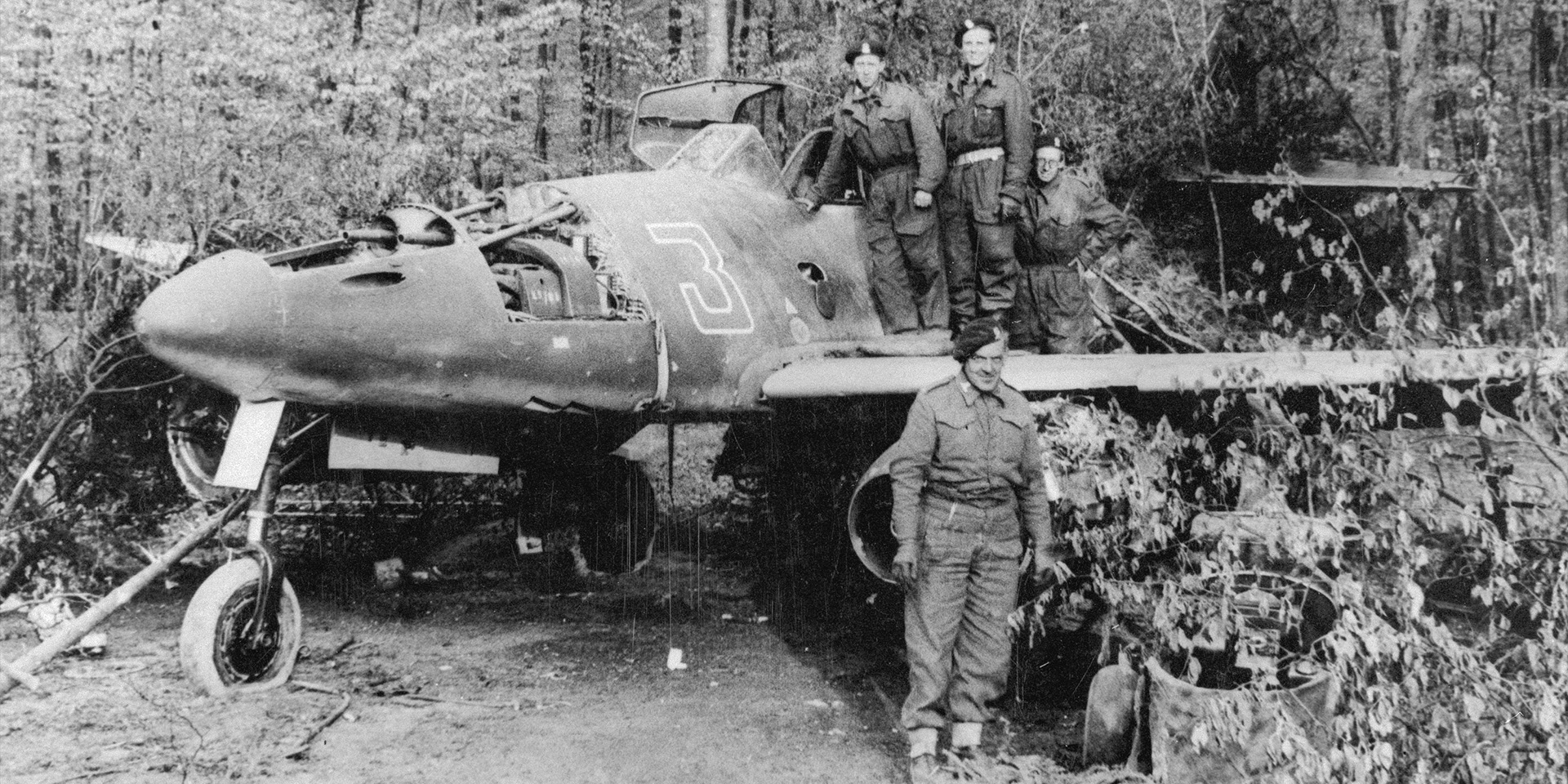 Examination of a German jet fighter by a British tank crew, May 1945