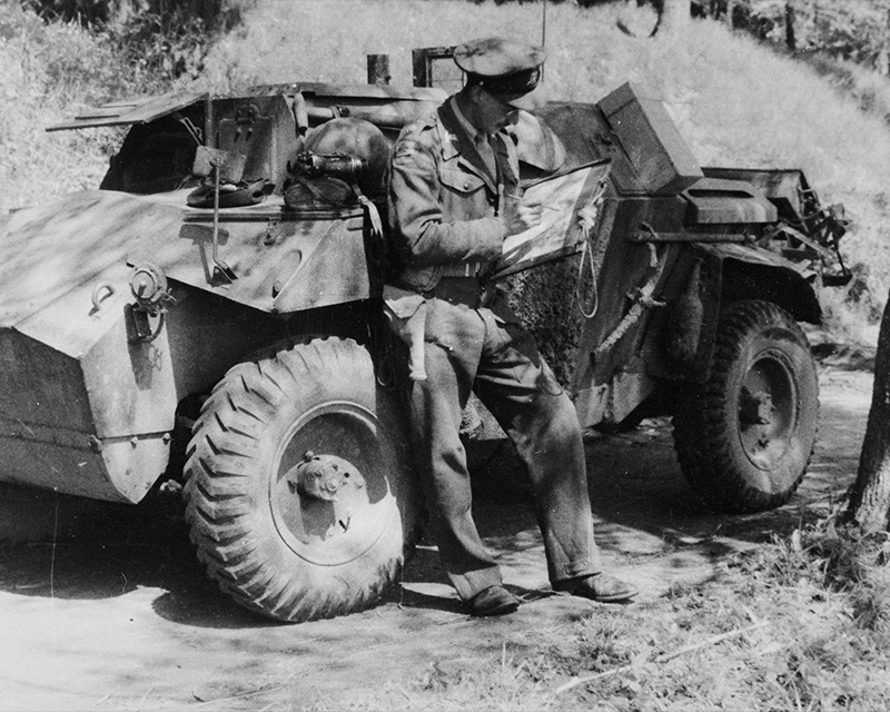 Lieutenant Ted Deeming, 15th/19th King’s Royal Hussars en route to Lubeck with Humber Scout Car, Germany, 8 May 1945