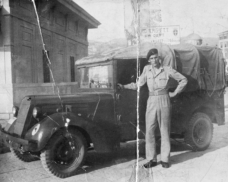 Driver Ray Lamb, Signal Squadron, British Expeditionary Trieste Forces, on the harbour front, Trieste, c1949