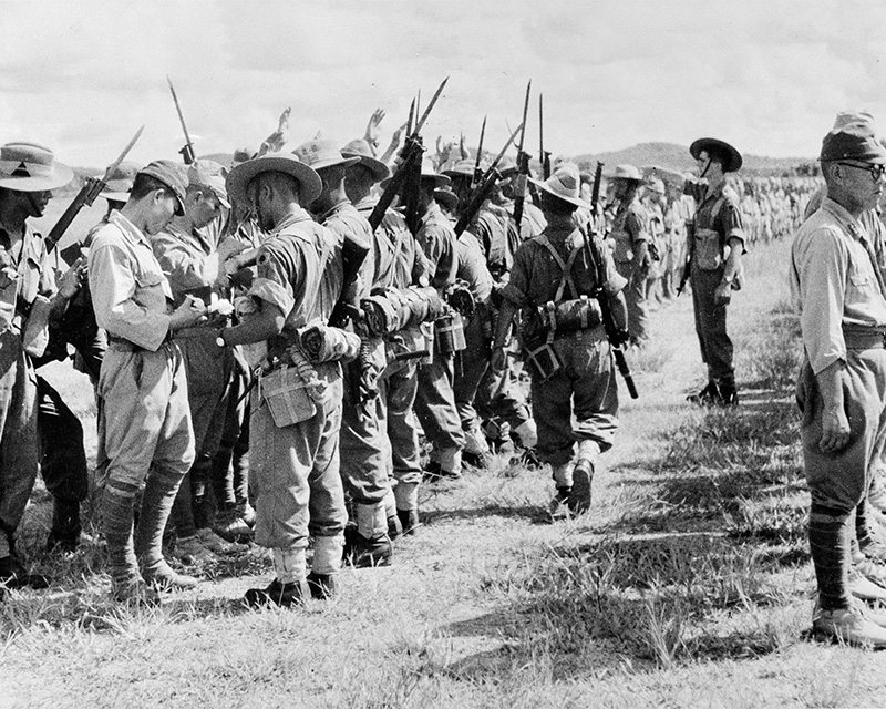Soldiers of the 25th Indian Division searching Japanese troops after their surrender in Kuala Lumpur, Malaya, 1945