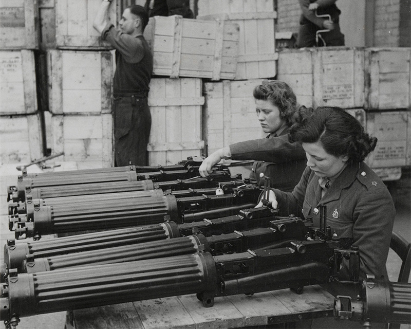 Members of the Auxiliary Territorial Service check lend-lease Vickers machine guns, Central Ordnance Depot, Weedon, Northamptonshire, 1942