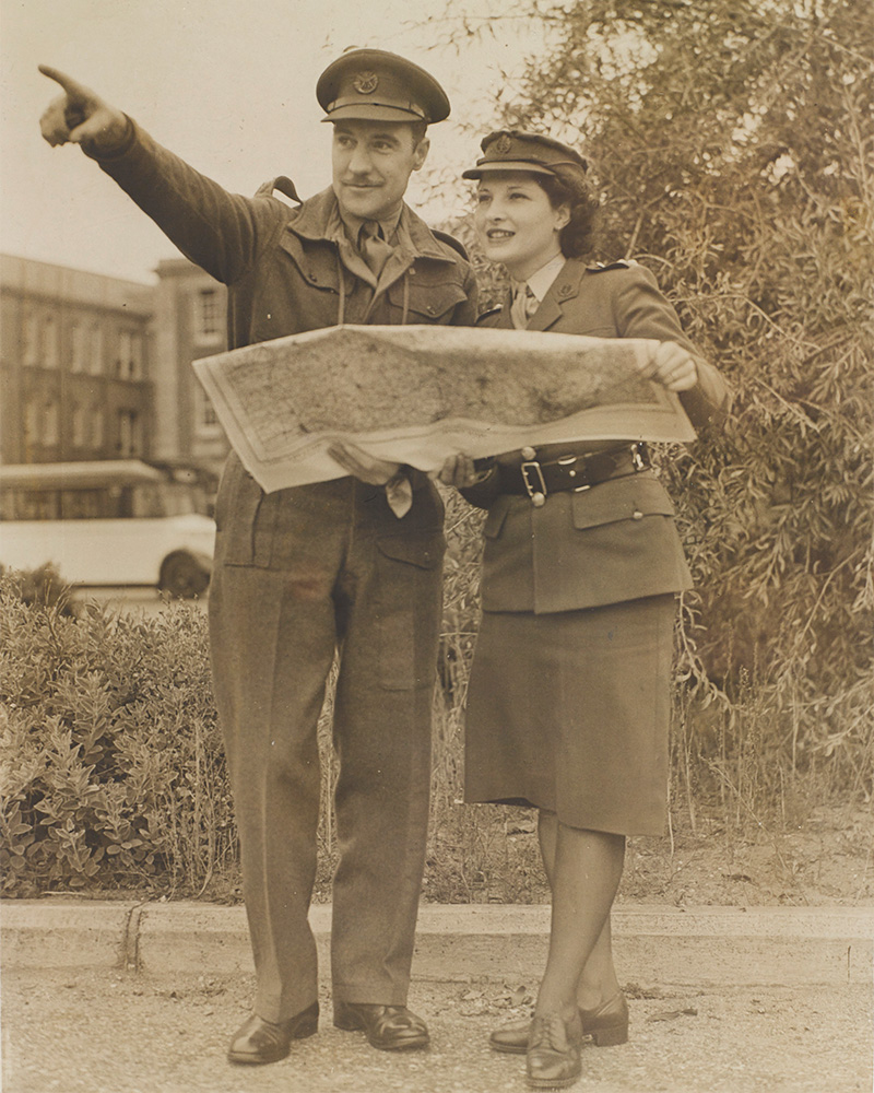 Captain Angove of the Duke of Cornwall's Light Infantry examines a map with a member of the Auxiliary Territorial Service, 1945