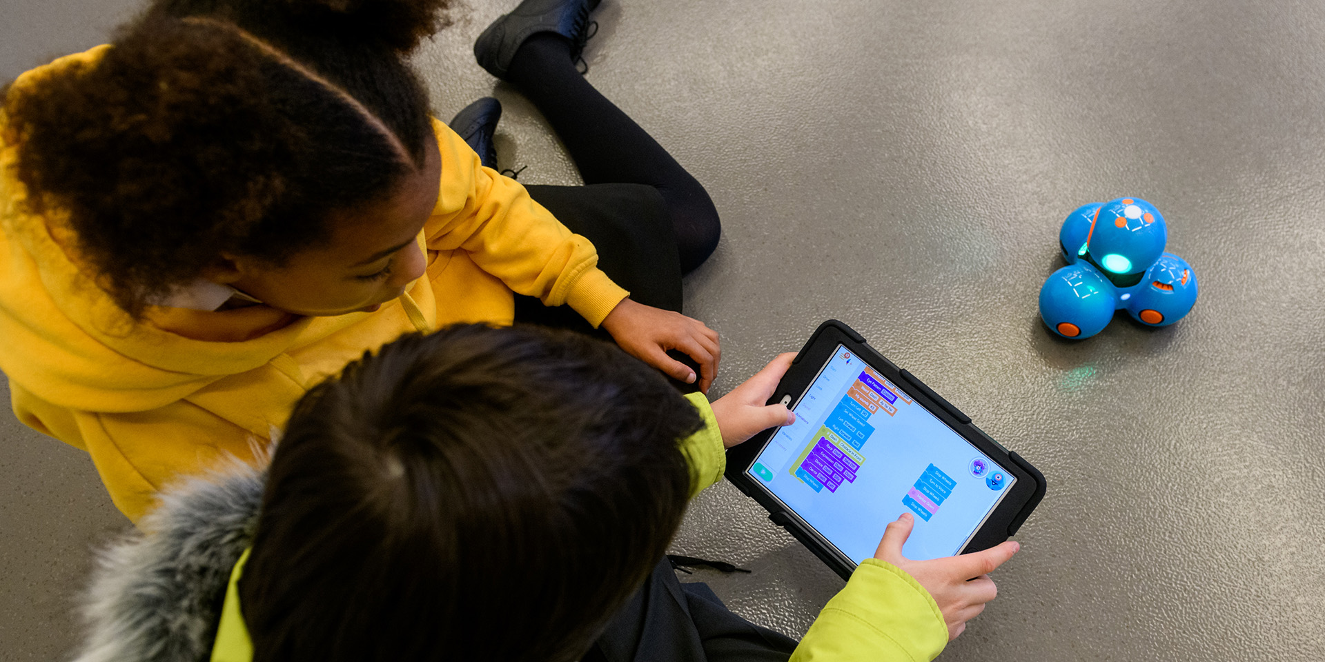 Children taking part in a robot coding challenge at the National Army Museum