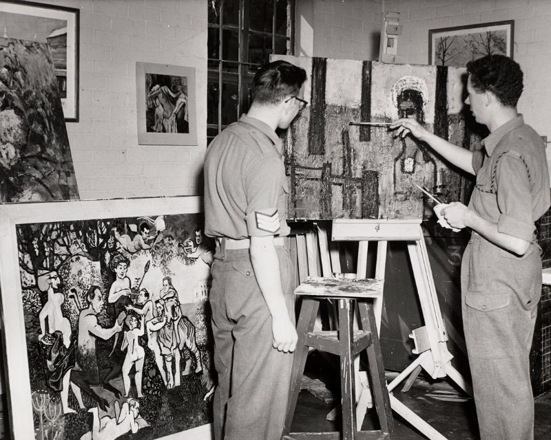 Soldiers painting in art class.