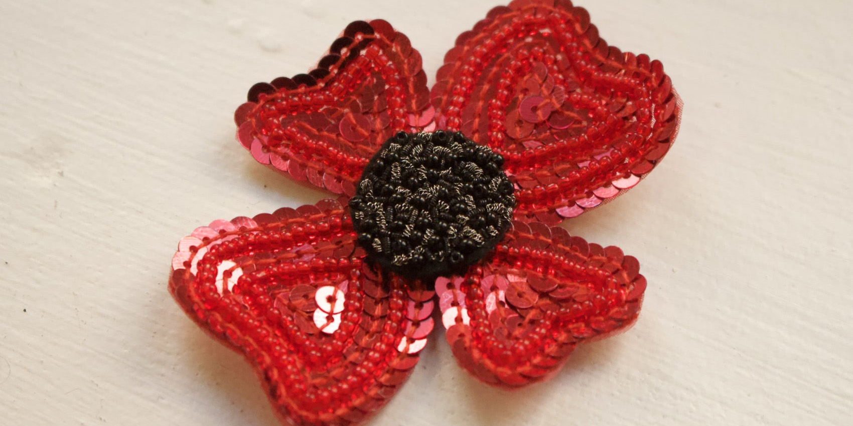 Hand & Lock poppy embroidery