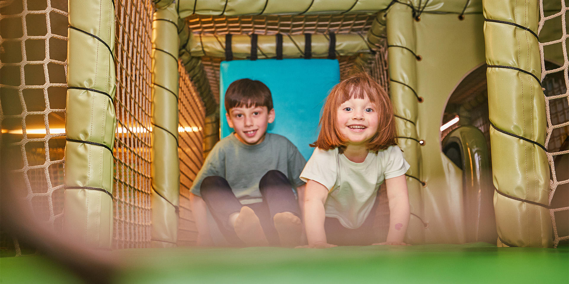 Children playing on the Play Base assault course