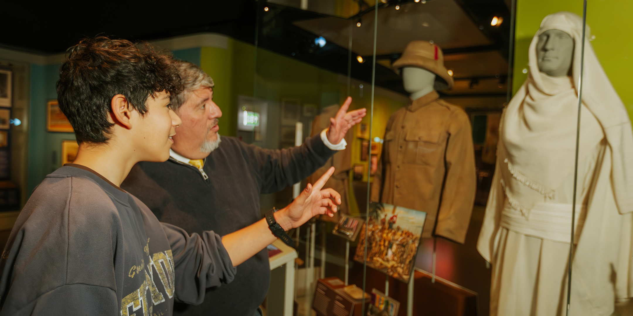 Father and son looking at Lawrence of Arabia