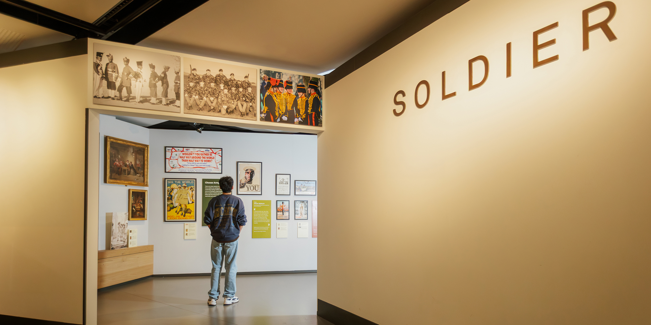 Teenager walking through the entrance to Soldier gallery