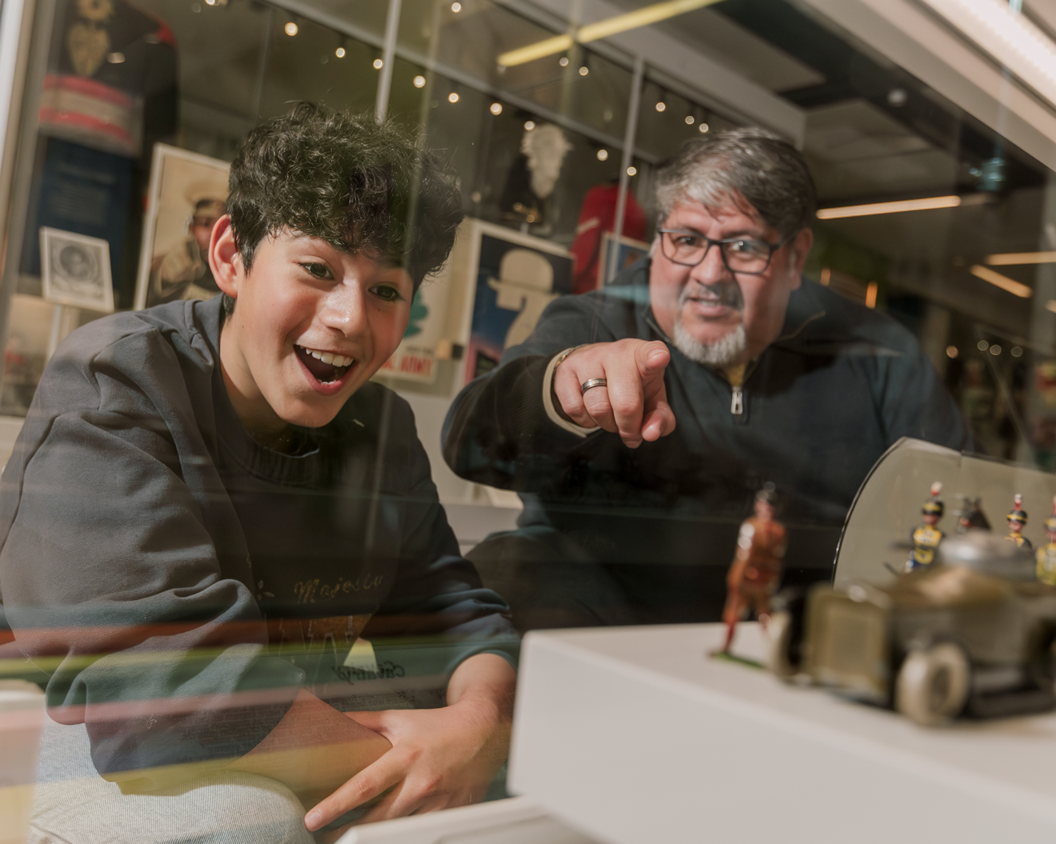 Father and son looking at objects in Formation gallery