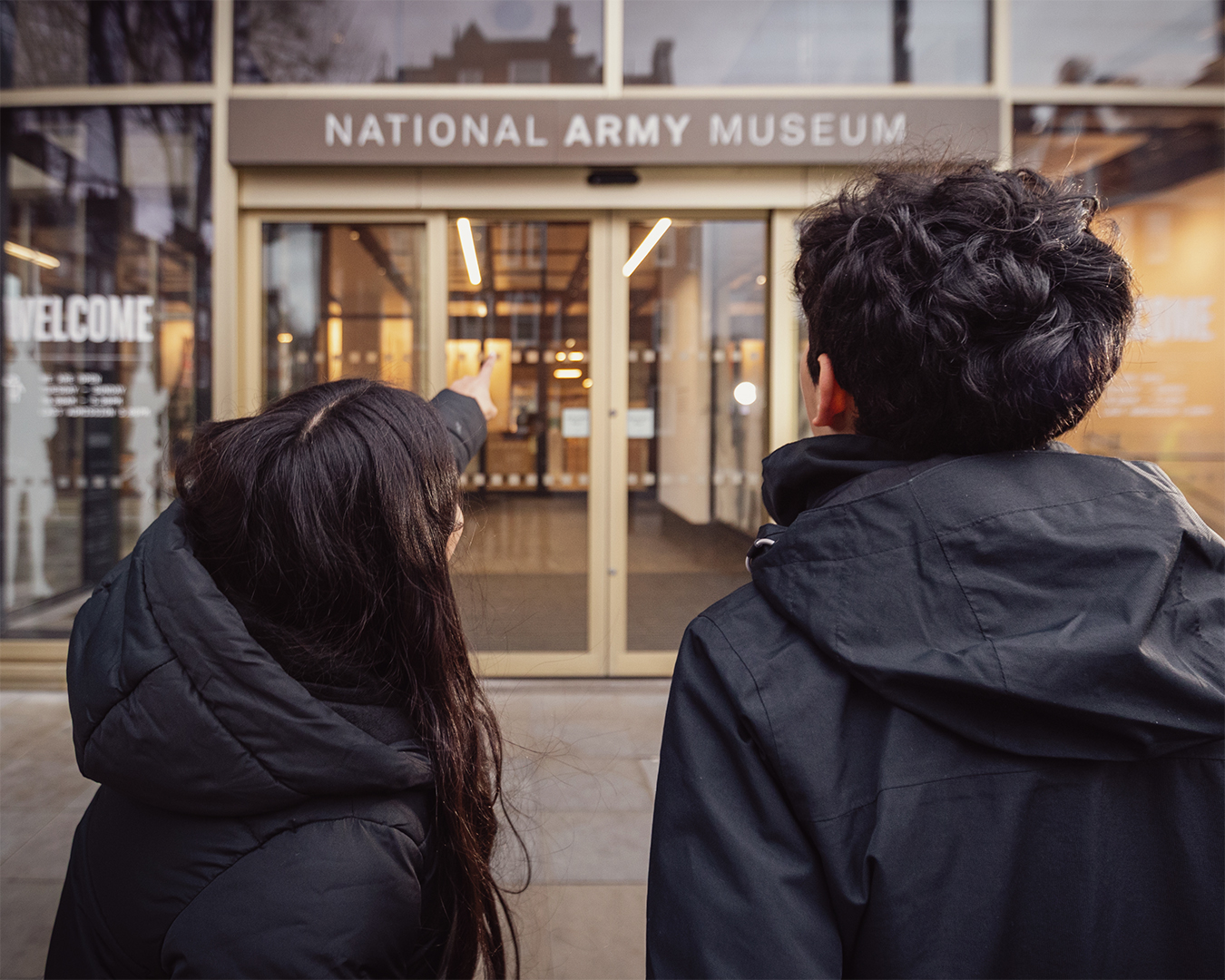 Young people looking at front entrance to the museum 