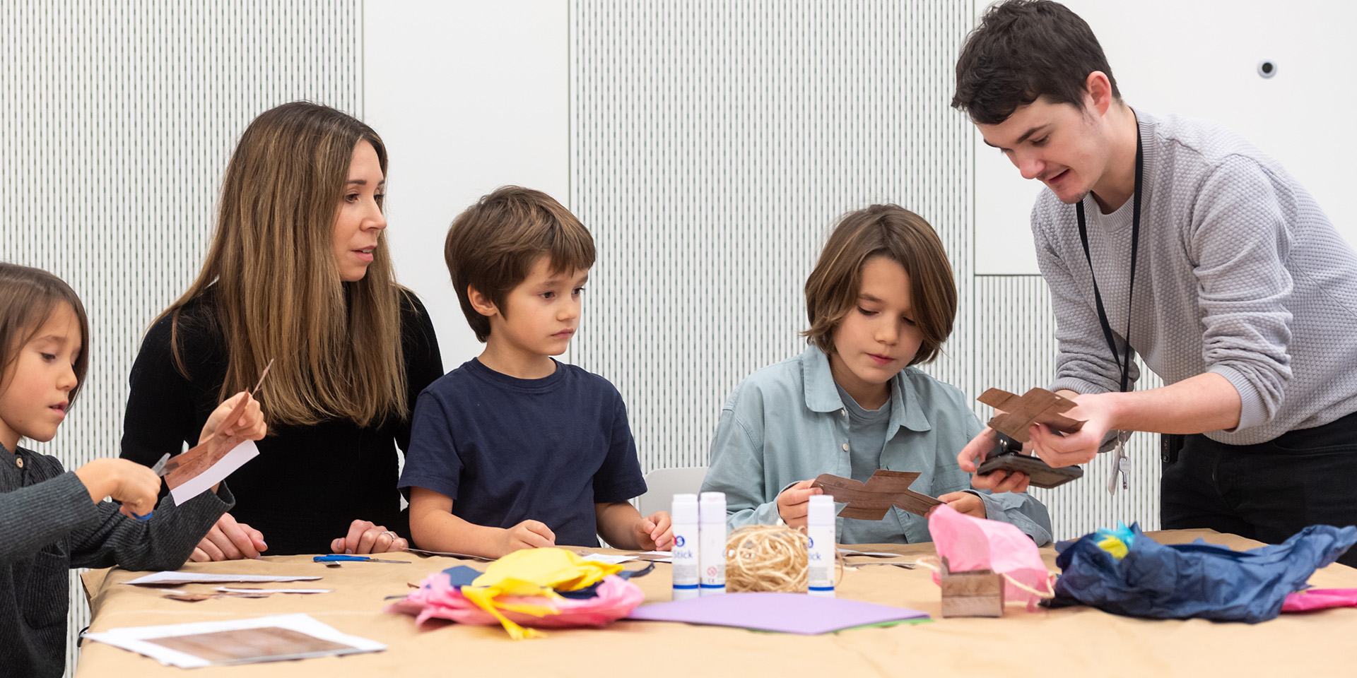 Family participating in a craft workshop