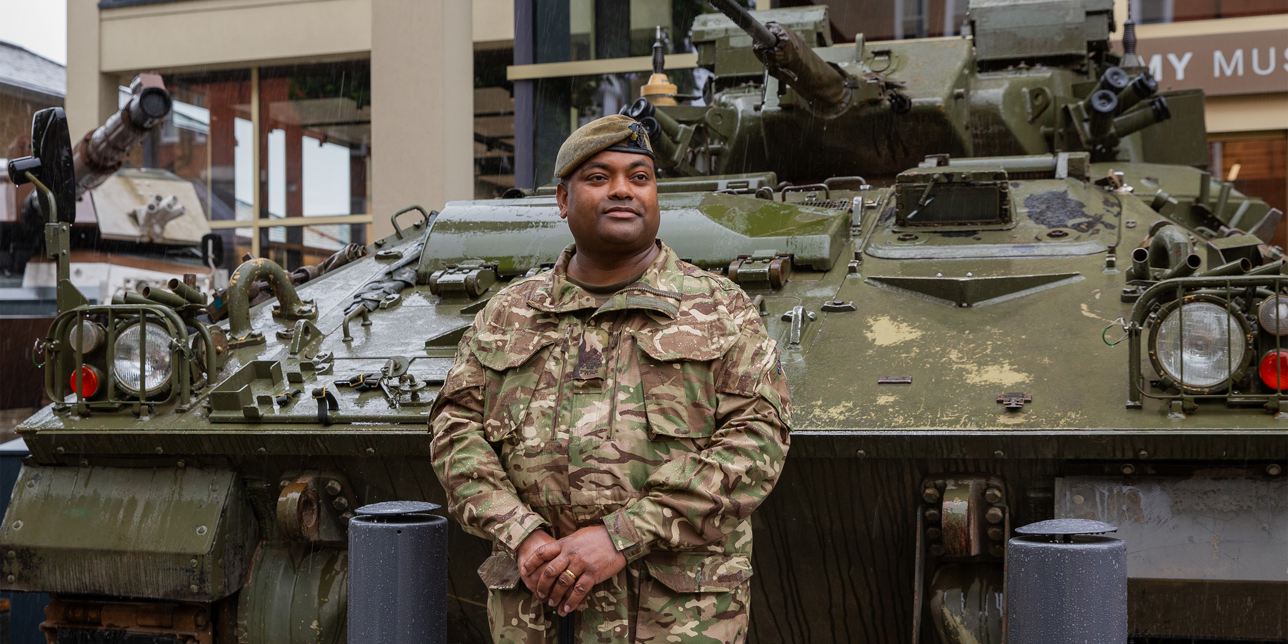 WO1 Johnson Beharry with Warrior Infantry Fighting Vehicle outside National Army Museum