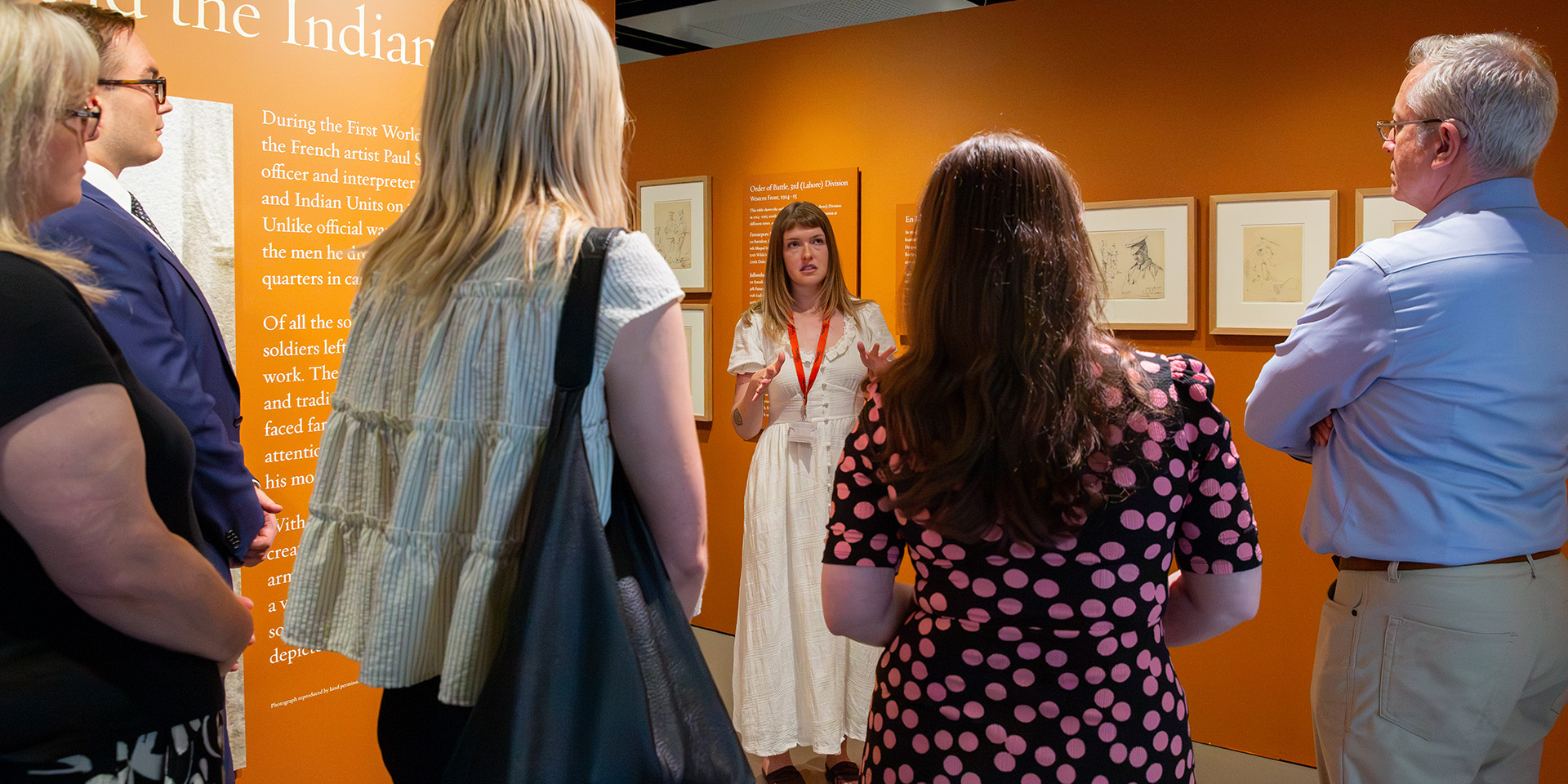 Visitors attending an exhibition tour