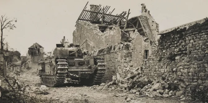A Churchill tank in a ruined Normandy village, 1944