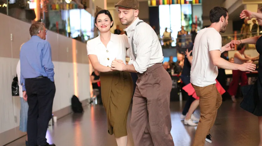 People dressed in 1940s style dancing at the National Army Museum