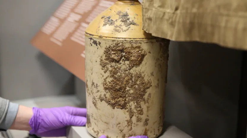 Installing a First World War rum jar in the Conflict in Europe gallery