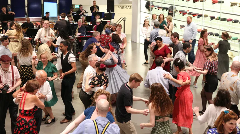 People dressed in 1940s style dancing at the National Army Museum
