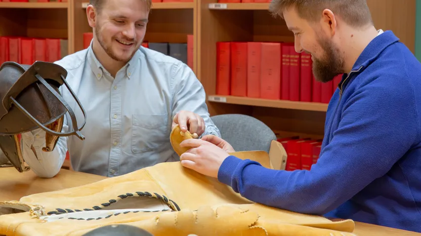 People feeling the textures of items in the handling collection