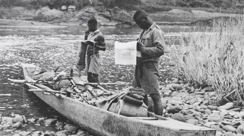 Soldiers of the 81st West African Division with a canoe, Burma, c1944