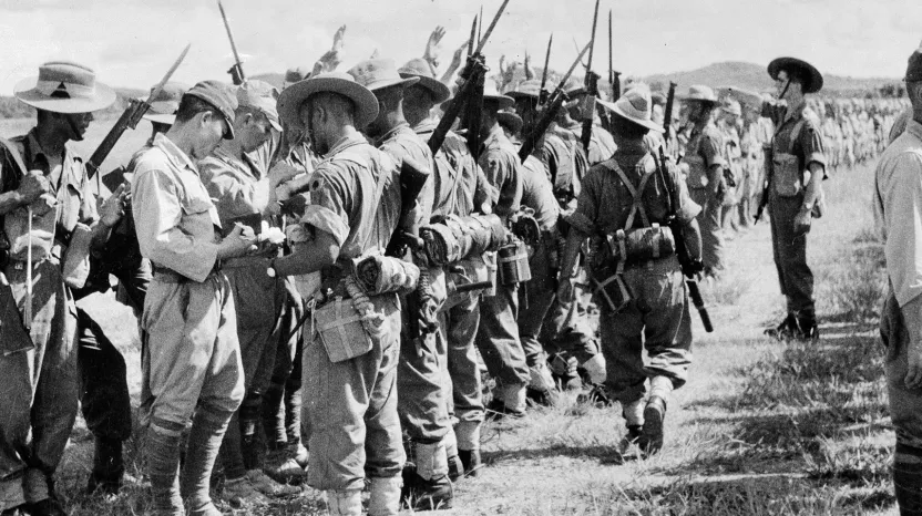 Soldiers of the 25th Indian Division searching Japanese troops after their surrender in Kuala Lumpur, Malaya, 1945