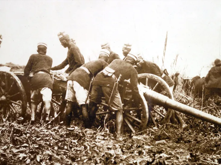 Askaris moving a field gun into position, c1914 