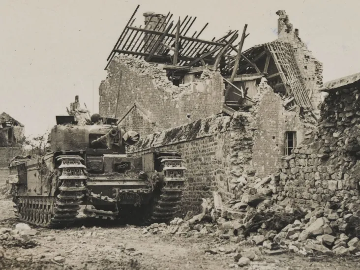 A Churchill tank in a ruined Normandy village, 1944