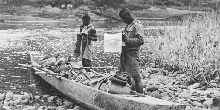 Soldiers of the 81st West African Division with a canoe, Burma, c1944