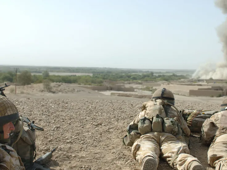 British soldiers watching the bombing of an enemy position in Musa Qala, 2006
