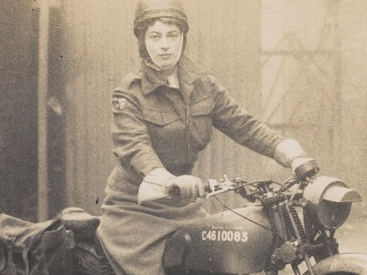 Valerie Erskine Howe, Auxiliary Territorial Service, on a motorbike, c1944