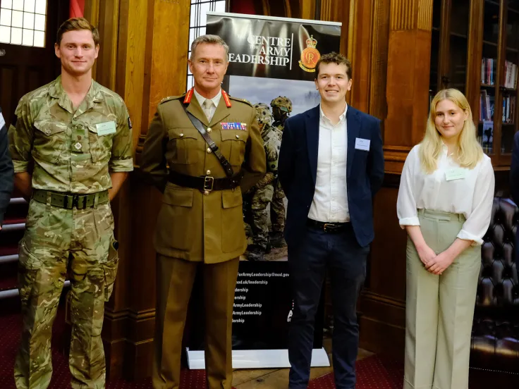 Essay prize winners stand with Museum Director, Justin Maciejewski, and Commandant General Zac Stenning