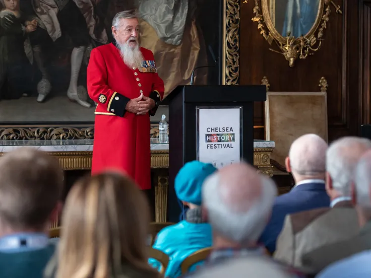 A Chelsea Pensioner giving a talk at the Royal Hospital