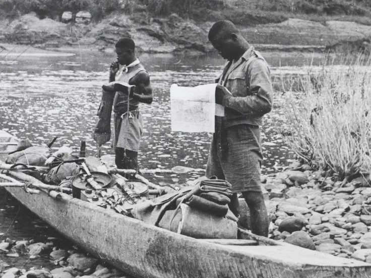 Soldiers of the 81st West African Division with a canoe, Burma, c1944