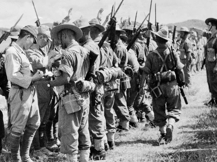 Soldiers of the 25th Indian Division searching Japanese troops after their surrender in Kuala Lumpur, Malaya, 1945