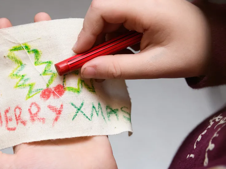 A child completing a craft at the National Army Museum.