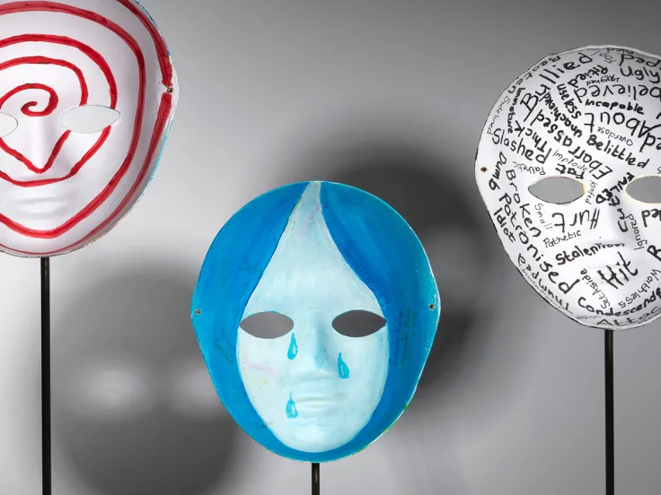 Three masks on display